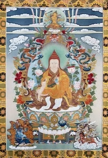 Vivid Tibetan thangka painting depicting Buddhist deities, colorful and intricate religious artwork.